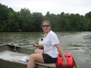Paige at the helm of our trusty jon boat. 