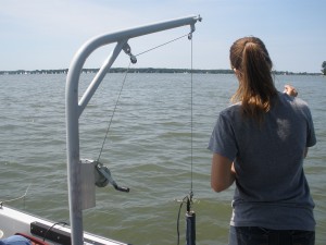 Measurement devices hang off the boat from this pulley system to collect data such as water pH, temperature, salinity, and oxygen level.