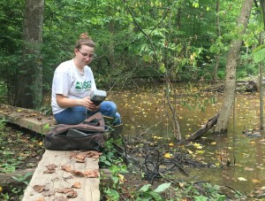 SERC intern Lauren Mosesso takes a water quality reading 