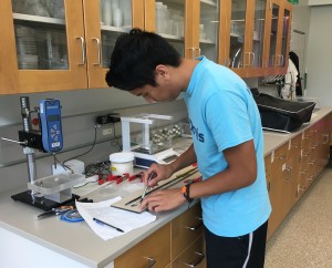Intern Cole Caceres creates artificial food gels for his experiment