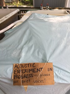 Intern Michelle Hauer’s experimental tank setup during recording stage. Sign over tank says, "ACOUSTIC EXPERIMENT IN PROGRESS--please use quiet voices!"