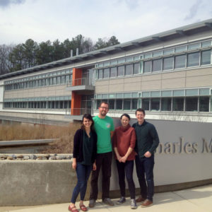 Four scientists in front of SERC lab building