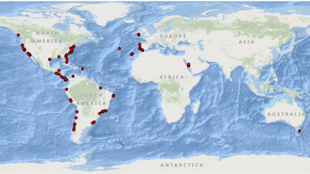 Map of the world, with red dots showing the locations of Ocean Travelers II sampling. Most dots are concentrated in North and South America, with some in Europe, Africa and Australia.